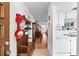 Bright entryway with hardwood floors, vintage bench, and view into living area at 601 N Hercules Ave # 503, Clearwater, FL 33765