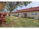 Building exterior showcasing landscaping and a grassy area at 601 N Hercules Ave # 503, Clearwater, FL 33765