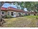 Tan building with red tile roof and a grassy yard at 601 N Hercules Ave # 503, Clearwater, FL 33765