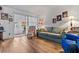 Relaxing living room with hardwood floors, sofa, and access to patio at 601 N Hercules Ave # 503, Clearwater, FL 33765