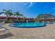 Inviting kidney-shaped pool with plenty of lounge chairs at 601 N Hercules Ave # 503, Clearwater, FL 33765