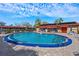 Community pool with surrounding patio furniture at 601 N Hercules Ave # 503, Clearwater, FL 33765