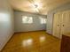 Spacious bedroom with hardwood floors, closet, and natural light from two windows at 6700 Turner N St, St Petersburg, FL 33702
