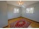 Bright bedroom with hardwood floors, ceiling fan, and dual windows for natural light at 6700 Turner N St, St Petersburg, FL 33702