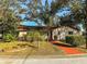 Charming single-story home featuring a well-maintained lawn, vibrant landscaping, and a cozy, inviting exterior at 6700 Turner N St, St Petersburg, FL 33702