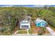 Aerial view shows the property's location among other houses with mature trees at 718 34Th S Ave, St Petersburg, FL 33705