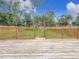 Fenced backyard view from deck at 718 34Th S Ave, St Petersburg, FL 33705