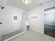 Bright bathroom with walk-in shower, patterned floor tile, and white vanity at 718 34Th S Ave, St Petersburg, FL 33705