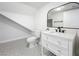 Modern bathroom with white vanity and patterned floor at 718 34Th S Ave, St Petersburg, FL 33705