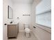Clean bathroom, featuring a vanity with a quartz countertop, and patterned floor tile at 718 34Th S Ave, St Petersburg, FL 33705