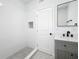 Modern bathroom with gray hex tile floors and white subway tile shower at 718 34Th S Ave, St Petersburg, FL 33705