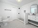 Modern bathroom with patterned tile floor and walk-in shower at 718 34Th S Ave, St Petersburg, FL 33705