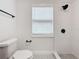 Simple bathroom with white subway tile shower and patterned floor tile at 718 34Th S Ave, St Petersburg, FL 33705