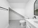 Simple bathroom with patterned floor, toilet, and vanity with a quartz countertop at 718 34Th S Ave, St Petersburg, FL 33705