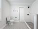 Updated bathroom with patterned floor tile, toilet, and walk-in shower at 718 34Th S Ave, St Petersburg, FL 33705