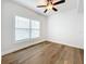 Bright bedroom with hardwood floors, ceiling fan, and large windows at 718 34Th S Ave, St Petersburg, FL 33705