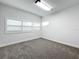 Well-lit bedroom with carpet, window with blinds, and neutral walls at 718 34Th S Ave, St Petersburg, FL 33705