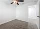 Bright bedroom with ceiling fan, neutral walls and gray carpeting at 718 34Th S Ave, St Petersburg, FL 33705