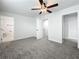Spacious bedroom with ceiling fan and en-suite bathroom at 718 34Th S Ave, St Petersburg, FL 33705