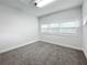 Spacious bedroom featuring three windows and neutral wall colors at 718 34Th S Ave, St Petersburg, FL 33705