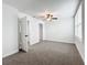 Large bedroom with ceiling fan and multiple doors at 718 34Th S Ave, St Petersburg, FL 33705