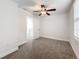 Bright bedroom with ceiling fan and access to hallway at 718 34Th S Ave, St Petersburg, FL 33705