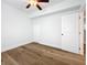 Spacious bedroom with hardwood floors, ceiling fan, and ample closet space at 718 34Th S Ave, St Petersburg, FL 33705