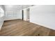 Bonus room with hardwood floors, white walls, and access to other rooms at 718 34Th S Ave, St Petersburg, FL 33705