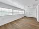 Bright bonus room with hardwood floors and wall-to-wall windows at 718 34Th S Ave, St Petersburg, FL 33705