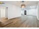 Bright dining room features hardwood floors and modern light fixture at 718 34Th S Ave, St Petersburg, FL 33705