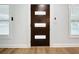 Modern dark brown front door with three frosted glass panels at 718 34Th S Ave, St Petersburg, FL 33705