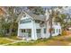 Charming craftsman style home features a renovated exterior, front porch, and landscaping at 718 34Th S Ave, St Petersburg, FL 33705