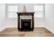 Modern fireplace with dark mantel and brick surround at 718 34Th S Ave, St Petersburg, FL 33705