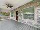 Front porch with stone veneer, new door, and ceiling fan at 718 34Th S Ave, St Petersburg, FL 33705