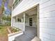 Front porch details: stonework, new flooring, and white railing at 718 34Th S Ave, St Petersburg, FL 33705