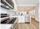 Modern kitchen with stainless steel appliances and white cabinets at 718 34Th S Ave, St Petersburg, FL 33705