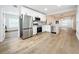 Open concept kitchen with stainless steel appliances and hardwood floors at 718 34Th S Ave, St Petersburg, FL 33705