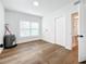 Laundry room with wood flooring, water heater, and ample space at 718 34Th S Ave, St Petersburg, FL 33705
