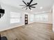 Bright living room with hardwood floors, fireplace, and ceiling fan at 718 34Th S Ave, St Petersburg, FL 33705