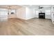 Bright living room with hardwood floors, fireplace, and ceiling fan at 718 34Th S Ave, St Petersburg, FL 33705