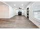 Hardwood floors, fireplace, and ceiling fan in bright living room at 718 34Th S Ave, St Petersburg, FL 33705