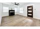 Hardwood floors, fireplace, and ceiling fan in bright living room at 718 34Th S Ave, St Petersburg, FL 33705