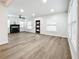 Bright living room with hardwood floors, fireplace, and ceiling fan at 718 34Th S Ave, St Petersburg, FL 33705