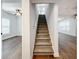Modern staircase with carpet runner and hardwood flooring on landing at 718 34Th S Ave, St Petersburg, FL 33705