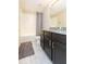 Modern bathroom with dark wood cabinets and granite countertops at 7236 Grand Elm Dr, Riverview, FL 33578