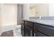 Bathroom with granite countertop and bathtub at 7236 Grand Elm Dr, Riverview, FL 33578
