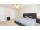 Spacious bedroom with king-size bed and ceiling fan at 7236 Grand Elm Dr, Riverview, FL 33578