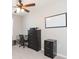 Bedroom with ceiling fan, dresser, and workspace at 7236 Grand Elm Dr, Riverview, FL 33578