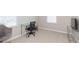Bright home office featuring a glass desk and comfortable office chair at 7236 Grand Elm Dr, Riverview, FL 33578