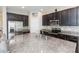 Modern kitchen with granite countertops and stainless steel appliances at 7236 Grand Elm Dr, Riverview, FL 33578